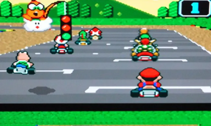 Jogo de corrida Super Mario Kart para Super Nintendo com tela da corrida dividida e Mario no alto